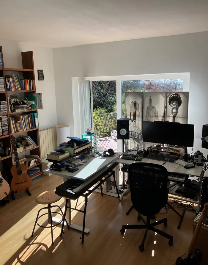 The same studio in daylight, with the woods through the window